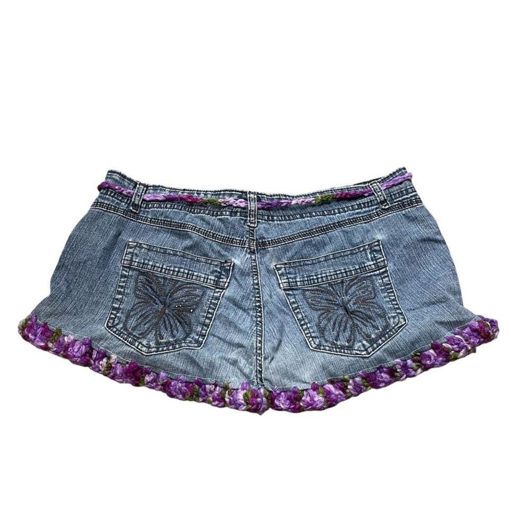 upcycled Y2K denim mini skirt with butterfly pocket detail and crochet hem